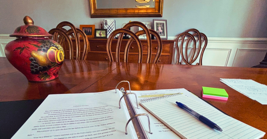 manuscript and notepad for revision